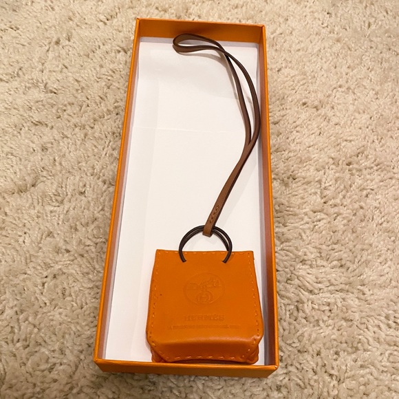 Hermes Accessories - Authentic Hermès Orange Charm in Milo lambskin